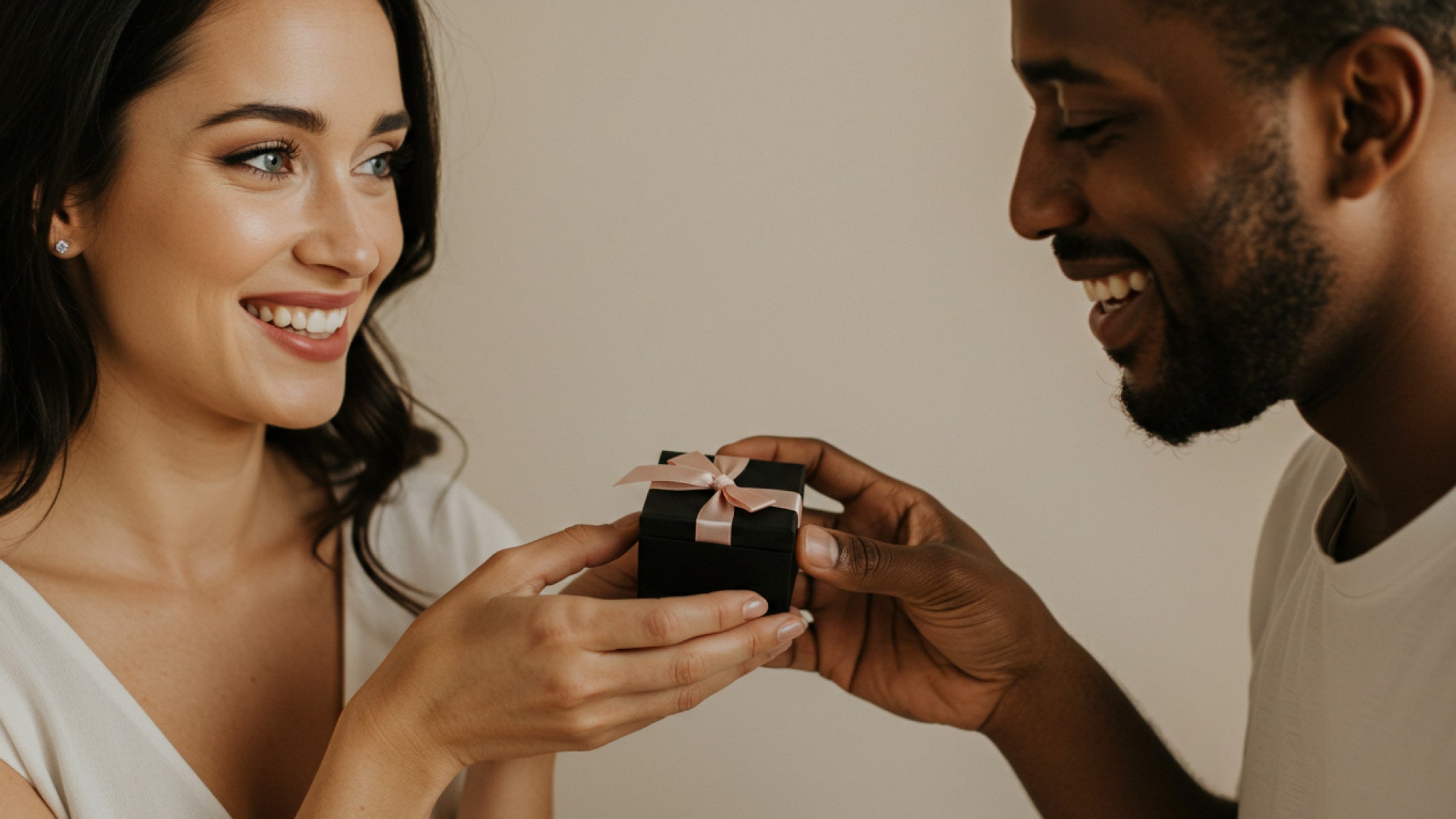 A romantic scene of a man giving his girlfriend a Shimansky Jewellery gift box