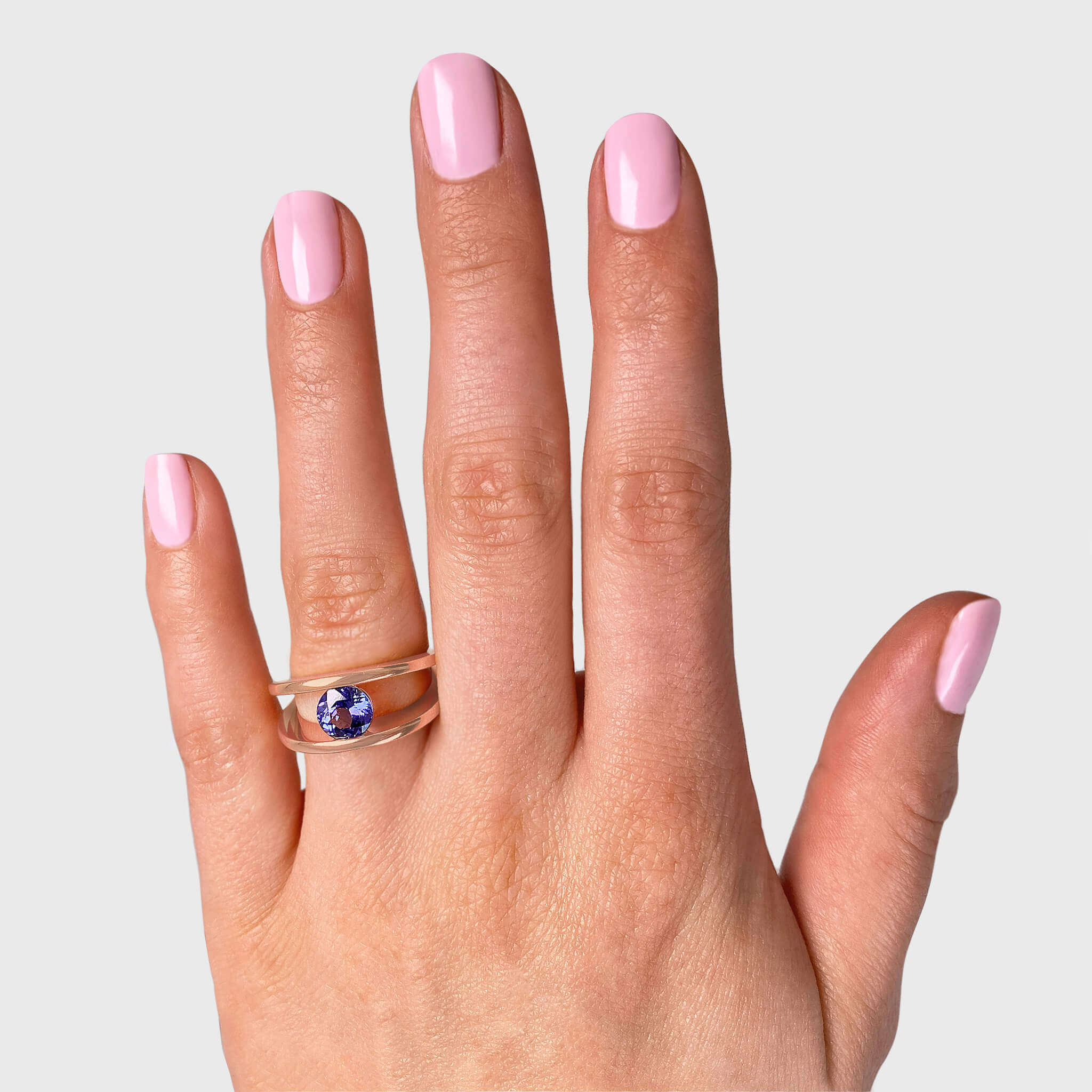Millennium Classic Tanzanite Ring 1.00 Carat in 14K Rose Gold Hand View #Metal_Rose Gold