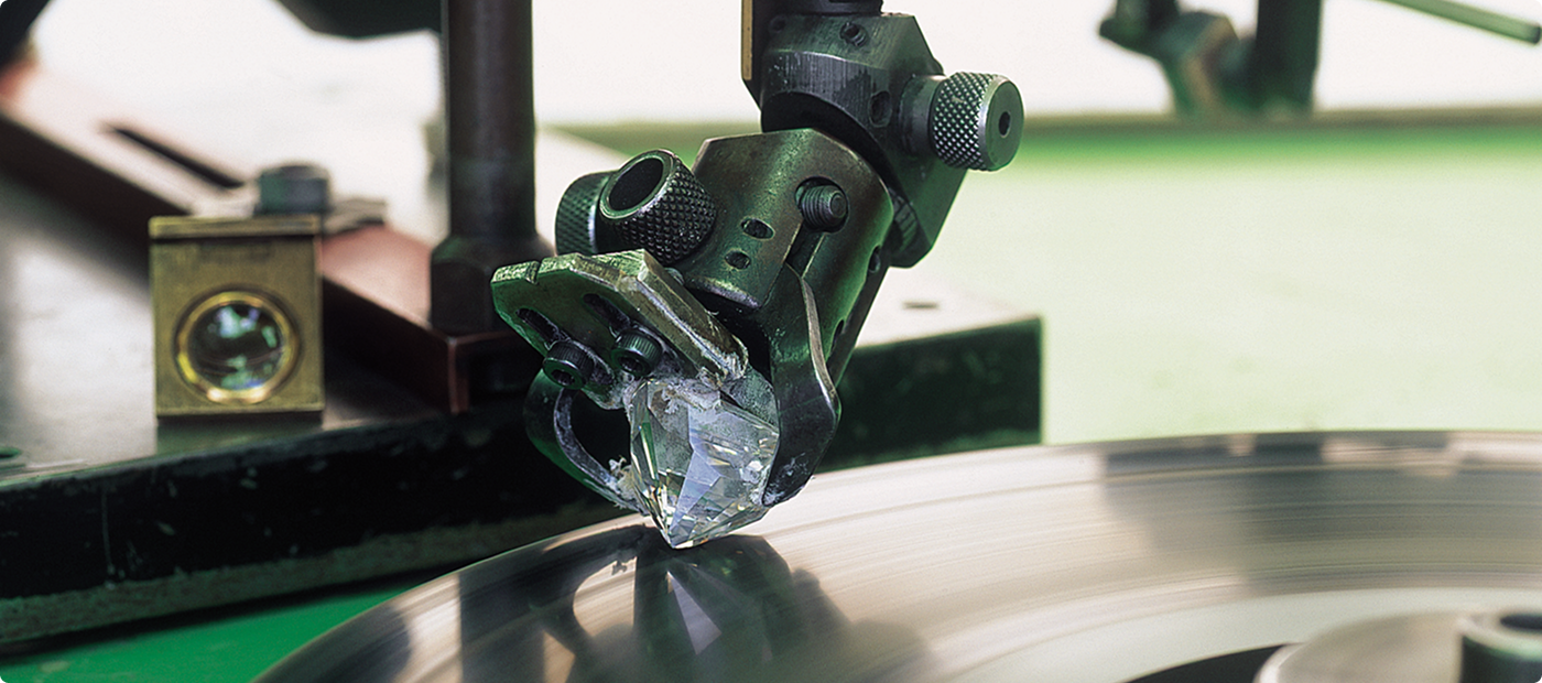 Un-cut South African diamond on a diamond polishing wheel at the Shimansky Diamond workshop in Cape Town.