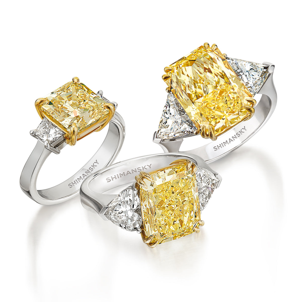 xquisite trio of fancy yellow diamond rings adorned with sparkling diamonds, crafted by Shimansky.