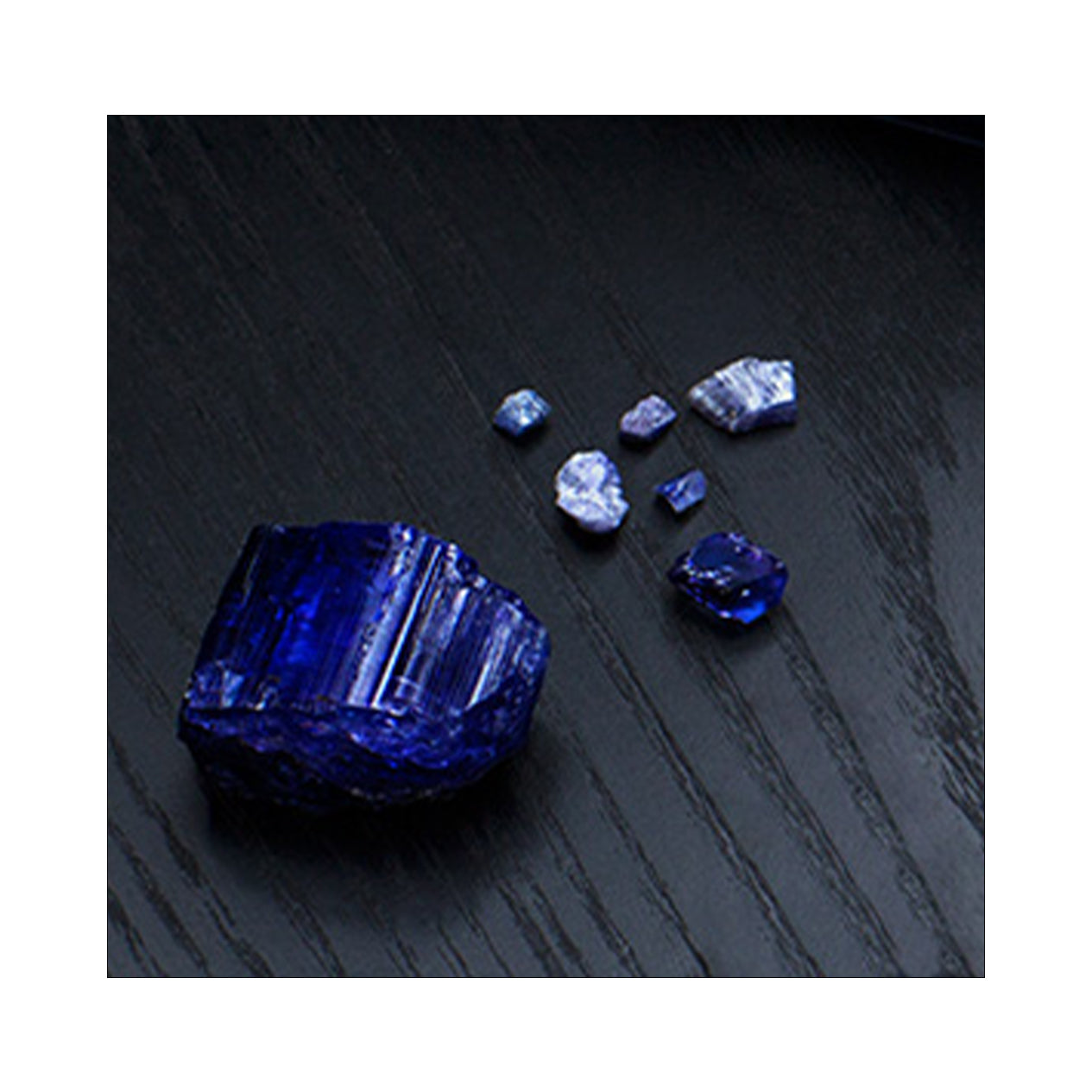 Stunning tanzanite stones, their rich blue colors harmoniously complementing each other in a luxurious display.