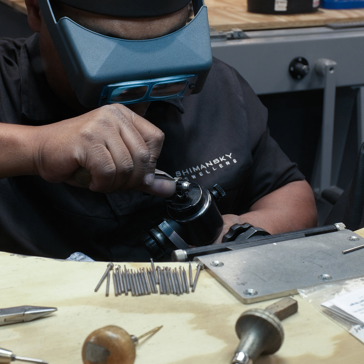 Shimasnky Jewellery cutting and polishing a diamond in the jewellery workshop