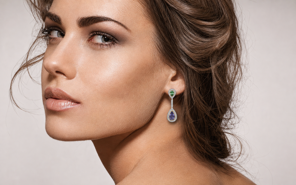 Shimansky pear-shaped Tanzanite and tsavorite drop earrings framed by a diamond halo, shown on a model