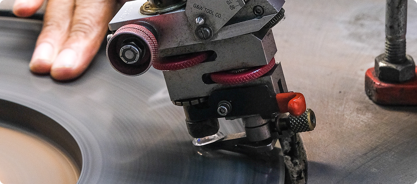 Rough diamond being polished on a scaife in the Shimansky diamonds cutting factory at Cape Town, South Africa raw crystal diamond transitioning to precision cut diamond.