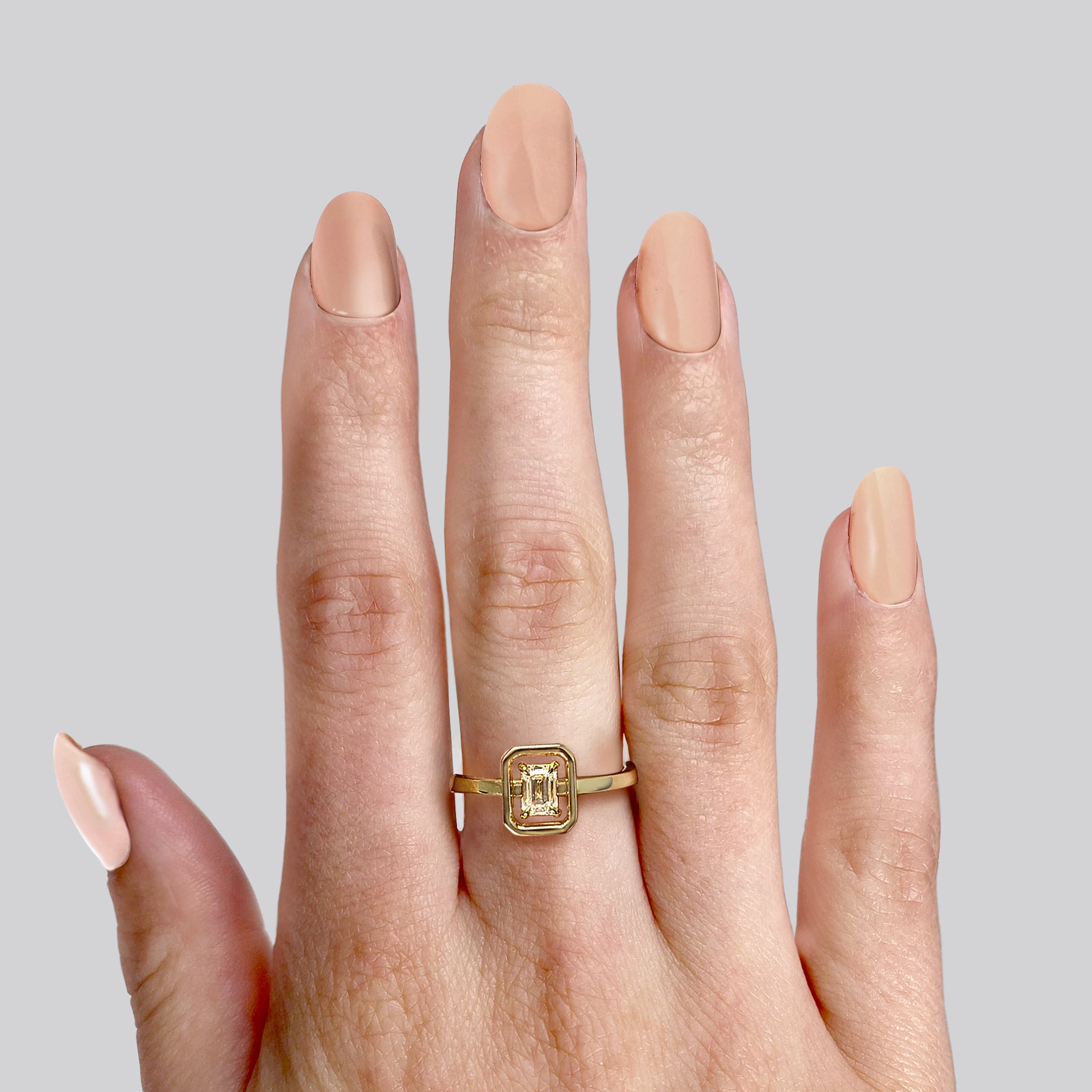 Shimansky - Women Wearing the Saturn Emerald Diamond Solitaire Ring 0.20ct crafted in 14K Yellow Gold