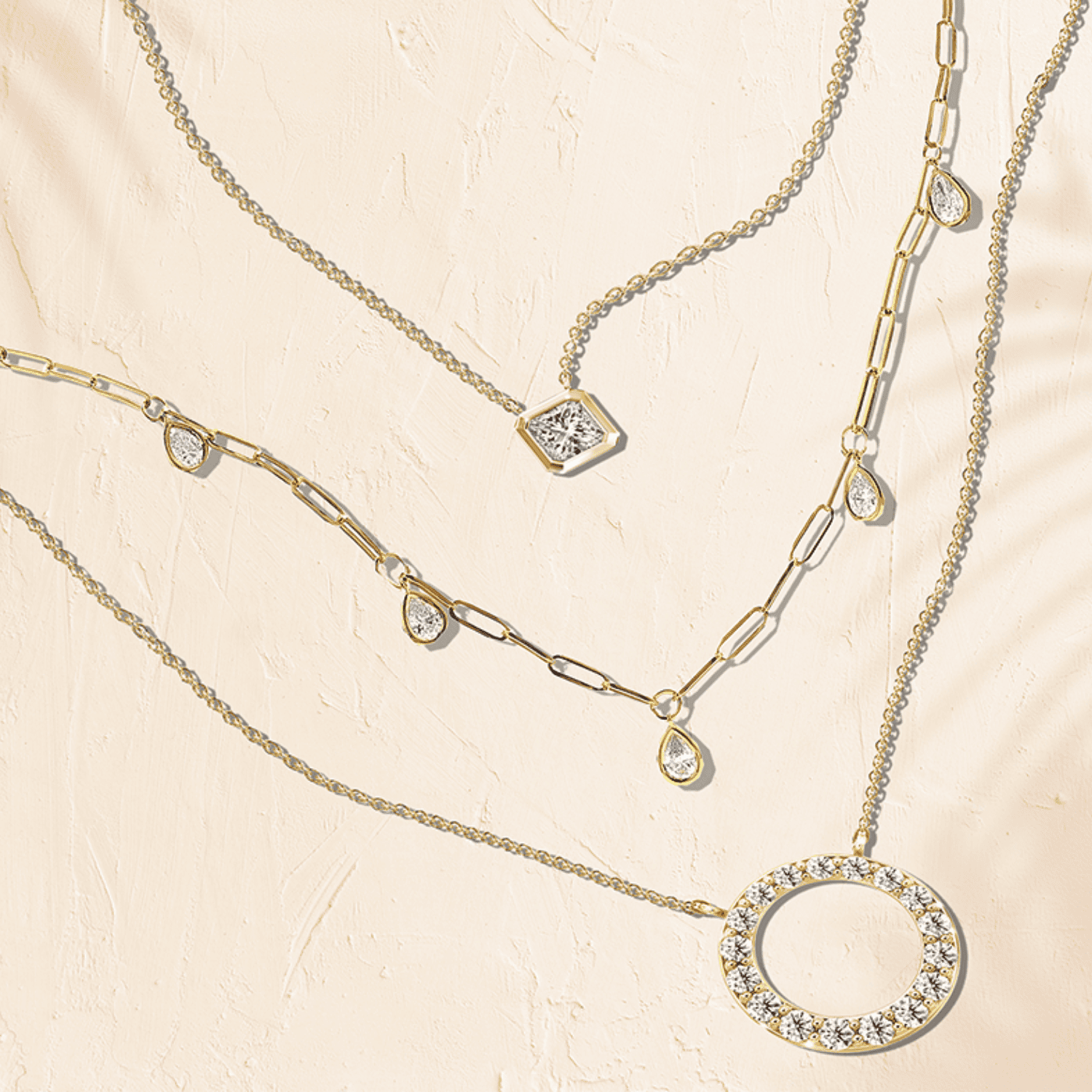 A trio of luxurious Shimansky necklaces, each embellished with brilliant diamonds, epitomizing sophistication and style.